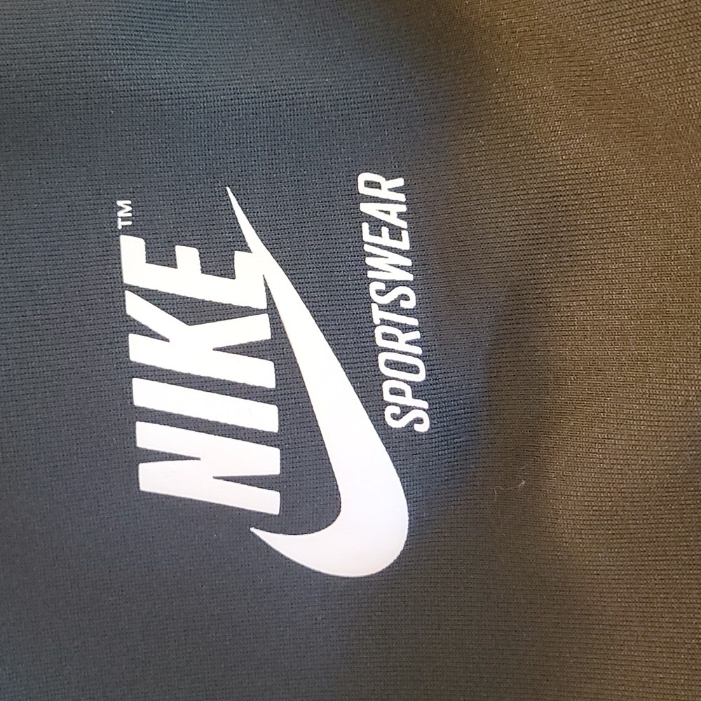 Green and white Nike sportswear pants
